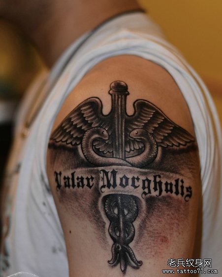 一款手臂十字架字母翅膀文身图案由武汉纹身店 推荐