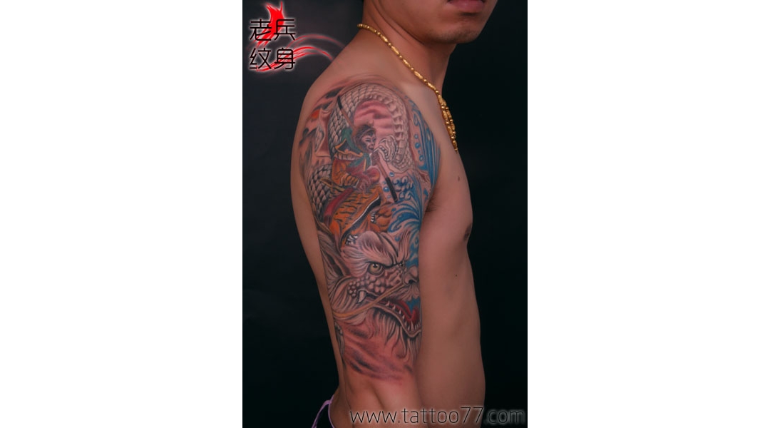 武汉纹身培训网：帅气的大臂孙悟空与小白龙纹身图案作品