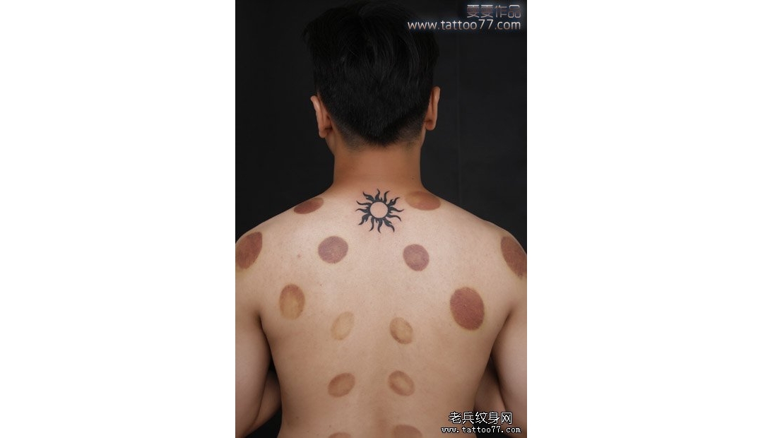 武汉老兵纹身店：帅气的颈部图腾太阳纹身图案作品