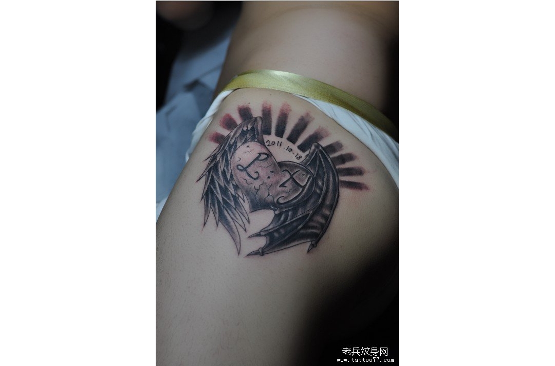 兵哥为武汉纹身爱好者制作的爱心翅膀纹身图案作品