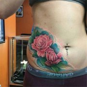 一款女性腹部彩色玫瑰花纹身图案由武汉纹身店推荐