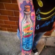 武汉纹身店推荐一款手臂彩色漂流瓶纹身图案