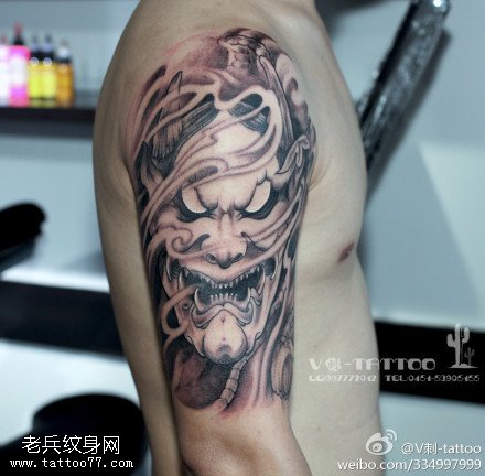 张牙舞爪鬼面纹身图案