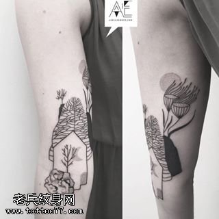 大臂上的小腿树苗纹身图案