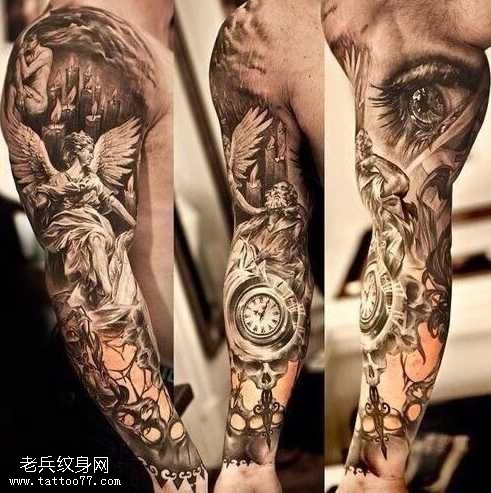 手臂怀表眼睛纹身图案