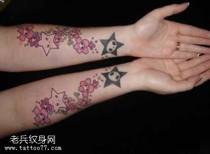 手臂一串星星纹身图案