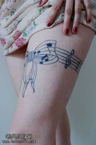 腿部蝴蝶结音符纹身图案
