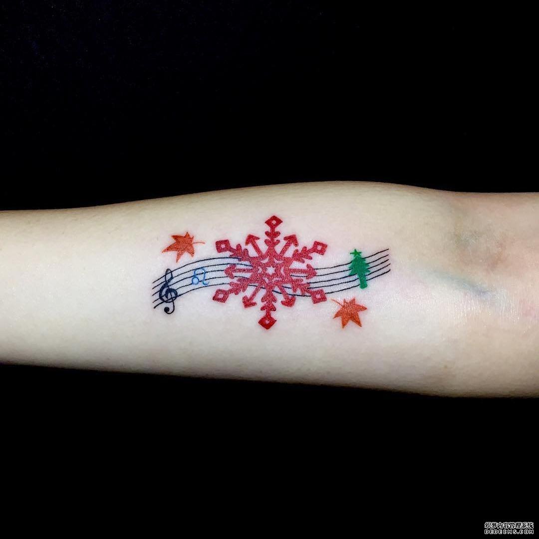 色彩雪花音符枫叶小臂纹身图案