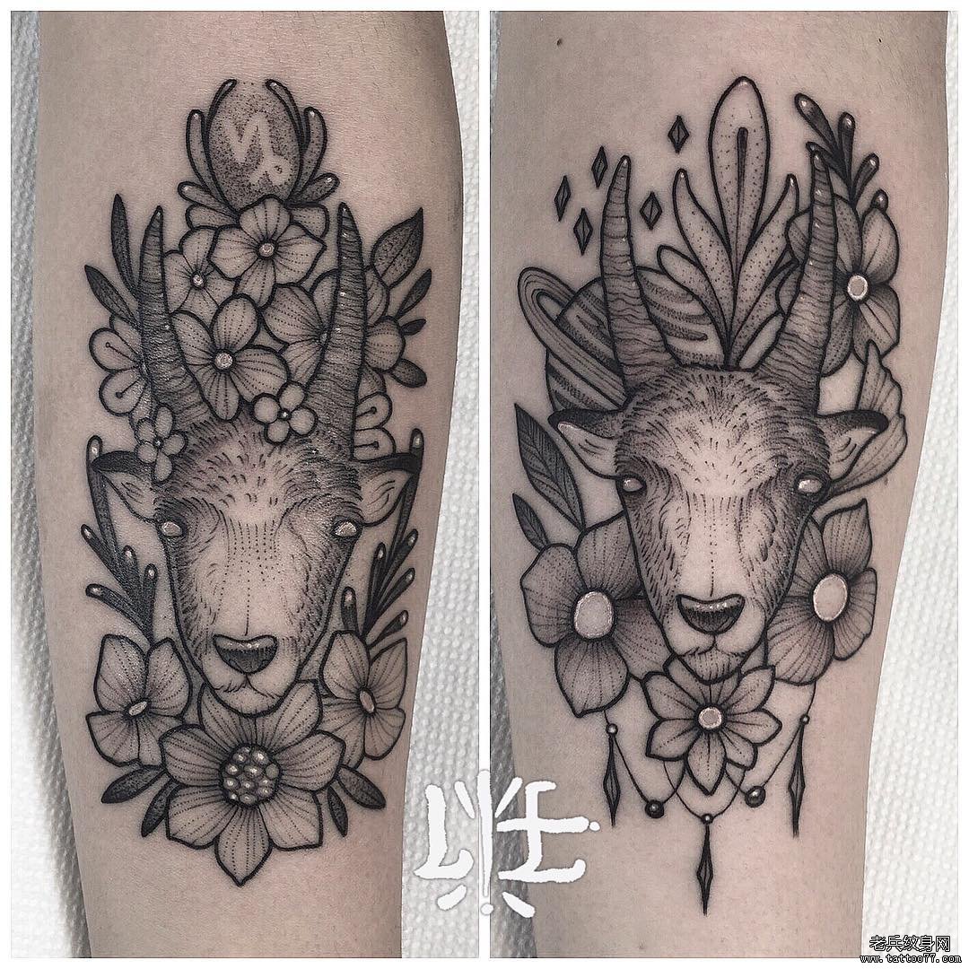 手臂黑灰摩羯花纹身