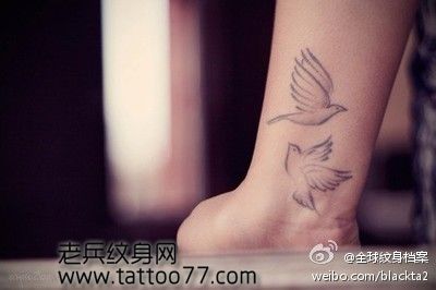 手臂唯美经典的图腾鸽子纹身图案